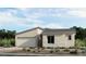 Beautiful single-story home with desert landscaping, a two-car garage, and stone accents at 12212 Elderwood St, Las Vegas, NV 89138