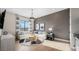 Cozy living room with hardwood floors, gray walls, and modern furniture arrangement at 12212 Elderwood St, Las Vegas, NV 89138