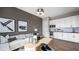 Bright living room featuring hardwood floors, a white sofa, and a wet bar at 12212 Elderwood St, Las Vegas, NV 89138