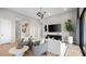 Comfortable living room with stylish chairs, modern decor, and a neutral color palette at 12212 Elderwood St, Las Vegas, NV 89138