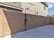 Private backyard with an outdoor shower against a brick wall at 1551 Boundary Peak Way, Las Vegas, NV 89135