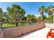Outdoor balcony with views of lush greenery, featuring a metal railing and space for outdoor seating at 1551 Boundary Peak Way, Las Vegas, NV 89135