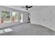Spacious bedroom with balcony access, showing neutral walls, soft carpet, and an airy, open feel at 1551 Boundary Peak Way, Las Vegas, NV 89135