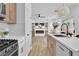 Stylish kitchen showcasing modern appliances, open shelving, and backyard views at 1551 Boundary Peak Way, Las Vegas, NV 89135
