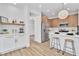 Bright kitchen with bar stool seating, white countertops, and stainless steel appliances at 1551 Boundary Peak Way, Las Vegas, NV 89135