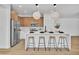 Kitchen island featuring barstool seating, modern pendant lights, and stainless steel appliances at 1551 Boundary Peak Way, Las Vegas, NV 89135