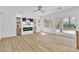 Contemporary living room with fireplace and shelving, with sliding door access to backyard at 1551 Boundary Peak Way, Las Vegas, NV 89135