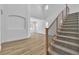 Elegant staircase with wooden accents and modern railings ascending to an open-concept living space at 1551 Boundary Peak Way, Las Vegas, NV 89135