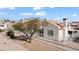 Desert community featuring stucco homes, terracotta roofs, xeriscaping, and white fences at 2152 High Dunes Ln, Laughlin, NV 89029