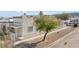 An aerial view of desert homes with white stucco, terracotta roofs, and rock landscape at 2152 High Dunes Ln, Laughlin, NV 89029