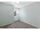 Neutral bedroom features a window with natural light, carpet, and ceiling fan at 2152 High Dunes Ln, Laughlin, NV 89029