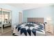 Bright bedroom with mirrored closet doors and light blue walls at 2152 High Dunes Ln, Laughlin, NV 89029