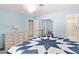 This bedroom has carpet, light blue walls, and a mirrored closet at 2152 High Dunes Ln, Laughlin, NV 89029