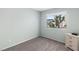Bright bedroom features natural light, neutral walls, and carpeted floors at 2152 High Dunes Ln, Laughlin, NV 89029