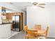 Bright dining area features a wooden dining set, stainless steel appliances, and a convenient open layout at 2152 High Dunes Ln, Laughlin, NV 89029