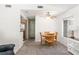 Cozy dining area with plush carpeting and a wooden dining set, adjacent to the kitchen at 2152 High Dunes Ln, Laughlin, NV 89029