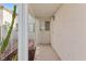 Inviting entryway featuring a covered porch, textured walls, and a secure front door with a security gate at 2152 High Dunes Ln, Laughlin, NV 89029