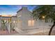 Charming single-Gathering home featuring a cozy front yard with secure white picket fence and desert landscaping at 2152 High Dunes Ln, Laughlin, NV 89029