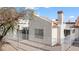 Exterior view of a home featuring a white stucco wall, terracotta tile roof, and white fencing at 2152 High Dunes Ln, Laughlin, NV 89029