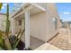 Charming home exterior with stucco siding, covered walkway, and desert landscaping at 2152 High Dunes Ln, Laughlin, NV 89029