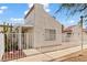 Charming single-story home featuring stucco exterior, covered entrance, and white picket fence at 2152 High Dunes Ln, Laughlin, NV 89029