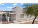 Charming single-story home featuring stucco exterior, covered entrance, and white picket fence at 2152 High Dunes Ln, Laughlin, NV 89029