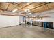 Open garage with concrete floor, insulated ceiling, and installed shelves at 2152 High Dunes Ln, Laughlin, NV 89029