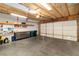Large garage with insulated ceiling, concrete floor, and storage shelving at 2152 High Dunes Ln, Laughlin, NV 89029