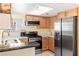 Well-lit kitchen with stainless steel appliances and wooden cabinets at 2152 High Dunes Ln, Laughlin, NV 89029