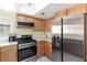 Bright kitchen featuring stainless steel appliances and light wood cabinetry at 2152 High Dunes Ln, Laughlin, NV 89029