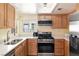 This kitchen has stainless steel appliances, white countertops, and bright lighting at 2152 High Dunes Ln, Laughlin, NV 89029