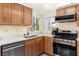 Updated kitchen with stainless steel appliances, light wood cabinets and stone counters at 2152 High Dunes Ln, Laughlin, NV 89029