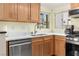 Kitchen features stainless steel appliances, light wood cabinets, and stone counters at 2152 High Dunes Ln, Laughlin, NV 89029