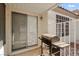 Outdoor patio features stucco siding, brick floor, and backyard view at 2152 High Dunes Ln, Laughlin, NV 89029