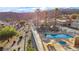 Community pool area with lush desert landscaping and mountain views at 2152 High Dunes Ln, Laughlin, NV 89029