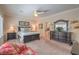 Comfortable bedroom with a large bed, dresser, and ample natural light from the window at 2225 Blackburn Hills Ave, Henderson, NV 89044