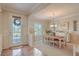 An inviting dining room with decorative trim, a chandelier, and natural light at 2225 Blackburn Hills Ave, Henderson, NV 89044