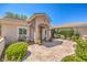 Charming courtyard with stamped concrete, mature plants, bench and water feature at 2225 Blackburn Hills Ave, Henderson, NV 89044