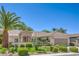Landscaped single-story home featuring a tiled roof, desert plants, and a paved driveway at 2225 Blackburn Hills Ave, Henderson, NV 89044