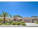 Charming single-story home showcasing a well-manicured lawn and desert landscaping at 2225 Blackburn Hills Ave, Henderson, NV 89044