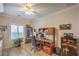 Comfortable home office with a wooden desk, built in bookcase, and natural light from the window at 2225 Blackburn Hills Ave, Henderson, NV 89044