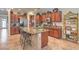 Open kitchen featuring stainless appliances, center island, and tile flooring at 2225 Blackburn Hills Ave, Henderson, NV 89044