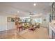 Bright living room features a fireplace, large windows, and comfortable sofas at 2225 Blackburn Hills Ave, Henderson, NV 89044