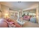 Spacious living room with multiple seating areas and seamless flow between rooms at 2225 Blackburn Hills Ave, Henderson, NV 89044