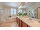 Well-lit main bathroom with double sinks, a soaking tub, and a glass-enclosed shower at 2225 Blackburn Hills Ave, Henderson, NV 89044