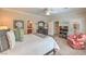 Spacious main bedroom with ensuite bathroom, TV, shutters, and large bed at 2225 Blackburn Hills Ave, Henderson, NV 89044