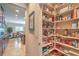 Walk-in pantry with floor-to-ceiling shelving provides ample storage for food and kitchen essentials at 2225 Blackburn Hills Ave, Henderson, NV 89044