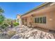 Relaxing patio features an outdoor dining set and beautifully landscaped backyard at 2225 Blackburn Hills Ave, Henderson, NV 89044