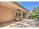 Inviting backyard patio with a dining set, grill, and well-manicured landscaping at 2225 Blackburn Hills Ave, Henderson, NV 89044