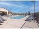 Community pool featuring lounge chairs and umbrellas for relaxing by the water at 226 Callen Falls Ave # 1311, Henderson, NV 89011